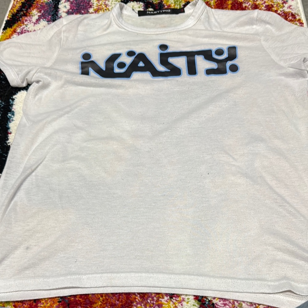 Good condition. Nasty Pig White Tee with Black and Blue Logo. Worn in perfectly